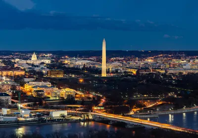 a view of Washington, DC at night from across the river in Virginia